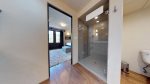 Primary bathroom with walk-in tiled shower